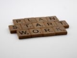 a scrabble of scrabble tiles spelling the words plan, start,