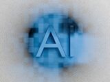 The letters ai are displayed on a blurred background.