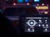 A dashboard of a car at night time