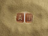 A close up of a word written in sand