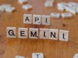 Scrabble tiles spelling the word genni on a wooden table