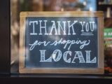 shallow focus photo of thank you for shopping signage