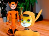 Two orange robots with animal-like features.