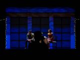 man and woman sitting on chair