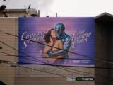 Billboard with woman and robot embracing
