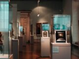 a museum filled with lots of glass cases