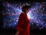 a woman in a red dress wearing a virtual reality headset