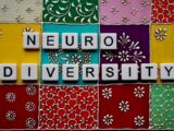 the word neuro university spelled with scrabble tiles