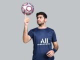 a man holding a ball