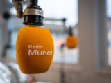 A radio munt hanging from a hook in a room