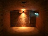 brown brick wall with light bulb