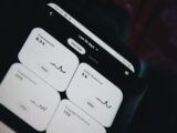 black smartphone showing white medication pill