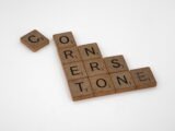 scrabble tiles spelling the word correrstone on a white background
