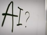 a sign with a question mark and a question mark drawn on it