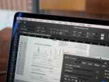 a close up of a computer screen with a table in the background
