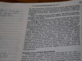 A close up of a book with writing on it