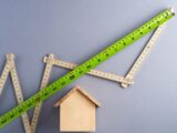 green ruler on white surface