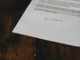 white printer paper on brown wooden table