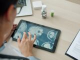 Doctor examining mri scans on a tablet screen