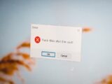 a close up of a computer screen with a sign on it