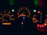 black and yellow analog speedometer