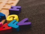 alphabet learning toy on gray apparel