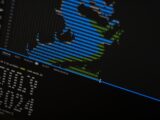 A close up of a computer screen with a monkey on it