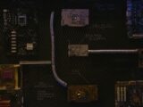 Artistic arrangement of circuit boards and cables symbolizes modern technology.